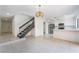 Open living area leads to the modern kitchen with stainless steel appliances at 3260 Longford Way, Las Vegas, NV 89121
