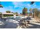 Inviting community pool area with lounge chairs and a seating area for relaxing poolside at 3260 Longford Way, Las Vegas, NV 89121