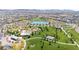A picturesque aerial view of a community park featuring a lake, green spaces, and walking trails at 329 Brockbank Pl, Henderson, NV 89011