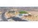 Aerial view showcasing a community park with playgrounds, a sports court, and picnic areas at 329 Brockbank Pl, Henderson, NV 89011