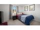 Comfortable bedroom with a full sized bed, neutral carpet, and modern decor at 329 Brockbank Pl, Henderson, NV 89011