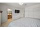 Spacious bedroom with an ensuite bathroom, TV, and closet space at 329 Brockbank Pl, Henderson, NV 89011
