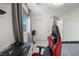 Bright bedroom featuring a desk, comfortable chair, and ample closet space at 329 Brockbank Pl, Henderson, NV 89011