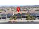 Charming two-story home with a tile roof, well-kept lawn, and a two-car garage, situated in a Gathering-friendly community at 329 Brockbank Pl, Henderson, NV 89011