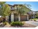 Charming two-story home with landscaped front, brick driveway and attached two car garage at 329 Brockbank Pl, Henderson, NV 89011
