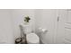 Simple and clean toilet with soft-close lid, small trash can and modern toilet paper holder at 329 Brockbank Pl, Henderson, NV 89011