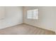 Bright bedroom features neutral carpet, a window with blinds, and neutral paint at 3318 N Decatur Blvd # 1061, Las Vegas, NV 89130