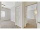 Bedroom with a window, neutral carpet, closet, and access to other rooms at 3318 N Decatur Blvd # 1061, Las Vegas, NV 89130