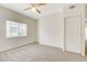 Bright bedroom with neutral carpet, ceiling fan, and natural light from the window at 3318 N Decatur Blvd # 1061, Las Vegas, NV 89130
