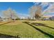 A spacious park features a grassy area, mature trees, and communal parking at 3318 N Decatur Blvd # 1061, Las Vegas, NV 89130