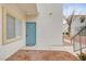 Welcoming condo entrance with a blue door, a small window and outdoor space at 3318 N Decatur Blvd # 1061, Las Vegas, NV 89130