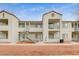 Multi-unit dwelling boasts a well-maintained exterior with balconies and stairways under a partly cloudy sky at 3318 N Decatur Blvd # 1061, Las Vegas, NV 89130