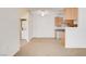 Open-plan living room with carpet and view into an adjacent laundry and kitchen at 3318 N Decatur Blvd # 1061, Las Vegas, NV 89130