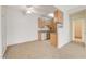 Open-plan living room with carpet and view into the kitchen and the hallway at 3318 N Decatur Blvd # 1061, Las Vegas, NV 89130