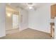 Open-plan living room with carpet, ceiling fan and view of an adjacent bathroom at 3318 N Decatur Blvd # 1061, Las Vegas, NV 89130