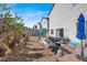 Backyard featuring lounge furniture, natural gas grill, and desert landscaping at 3389 Commendation Dr, Las Vegas, NV 89117
