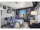 Raiders themed bedroom with decorated walls, wooden floors, and a window with natural light at 3389 Commendation Dr, Las Vegas, NV 89117