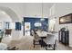Bright dining room with high ceilings, stylish furnishings, and a view into the living area at 3389 Commendation Dr, Las Vegas, NV 89117