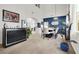Open-concept dining area featuring high ceilings, neutral-toned walls, carpet flooring, and modern decor at 3389 Commendation Dr, Las Vegas, NV 89117