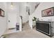 Inviting entryway with tile and carpet flooring, staircase, decor and a console table at 3389 Commendation Dr, Las Vegas, NV 89117