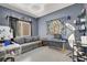 An eye catching room features a neutral sofa and tattoo equipment with grey tile floors at 3389 Commendation Dr, Las Vegas, NV 89117