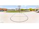 Community basketball court surrounded by green space, landscaping, and nearby homes at 3518 Herodain Ave, Las Vegas, NV 89106