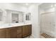 Bright bathroom featuring a double vanity and a walk-in shower at 3518 Herodain Ave, Las Vegas, NV 89106