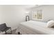 Bright bedroom with a comfortable bed, a full-length mirror, and a window with blinds at 3518 Herodain Ave, Las Vegas, NV 89106