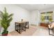 Dining area with seating for two and views from the adjacent window at 3518 Herodain Ave, Las Vegas, NV 89106