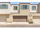 Townhome featuring a two-car garage and neutral color scheme at 3518 Herodain Ave, Las Vegas, NV 89106