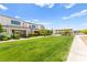 Beautiful townhome exterior with a well-manicured lawn and access to a picnic area at 3518 Herodain Ave, Las Vegas, NV 89106
