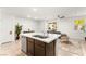 Modern kitchen with island, stainless steel appliances and lots of natural light at 3518 Herodain Ave, Las Vegas, NV 89106