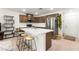 Modern kitchen with island seating, stainless steel appliances, and ample cabinet space at 3518 Herodain Ave, Las Vegas, NV 89106