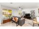 Cozy living room with tile floors, modern shelving and grey sofa near sunny window at 3518 Herodain Ave, Las Vegas, NV 89106