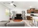 Open concept living space with modern shelving, tile floors and bar seating at 3518 Herodain Ave, Las Vegas, NV 89106