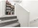 Carpeted staircase with white walls and built-in step lighting at 3518 Herodain Ave, Las Vegas, NV 89106