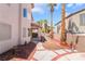 Spacious backyard with brick-lined accents, mature trees, and a covered patio at 3786 Port Ritchey St, Las Vegas, NV 89147