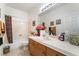 Well-lit bathroom featuring a spacious vanity and tub, offering a tranquil retreat for relaxation and self-care at 3786 Port Ritchey St, Las Vegas, NV 89147