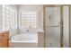 Luxurious bathroom with a soaking tub and a glass-enclosed shower at 3786 Port Ritchey St, Las Vegas, NV 89147