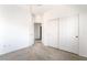 Neutral carpeted bedroom featuring bright walls, sliding door closet, and entry to hallway at 3786 Port Ritchey St, Las Vegas, NV 89147