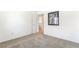Neutral carpeted bedroom featuring bright walls with picture frame, and entry to upper level at 3786 Port Ritchey St, Las Vegas, NV 89147