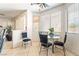 Bright dining area with large windows and a glass table, perfect for Gathering meals and entertaining guests at 3786 Port Ritchey St, Las Vegas, NV 89147