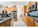 Well-equipped kitchen featuring stainless steel appliances, granite countertops, and ample cabinet space for storage at 3786 Port Ritchey St, Las Vegas, NV 89147