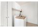 Bright laundry room equipped with modern appliances and ample storage, enhancing the convenience of household chores at 3786 Port Ritchey St, Las Vegas, NV 89147