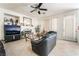 Bright living room with a fireplace, large windows, and open space, ideal for entertaining and relaxing at 3786 Port Ritchey St, Las Vegas, NV 89147