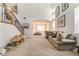 Bright living room with staircase, neutral carpeting, and stylish decor at 3786 Port Ritchey St, Las Vegas, NV 89147