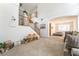 Spacious living room with staircase, plush carpeting, and a connecting sitting room at 3786 Port Ritchey St, Las Vegas, NV 89147
