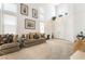 Bright living room with high ceilings, neutral carpeting, and stylish decor at 3786 Port Ritchey St, Las Vegas, NV 89147