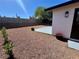 Low maintenance backyard featuring decorative gravel and a concrete patio, perfect for outdoor entertaining at 407 Tiger Lily Way, Henderson, NV 89015