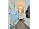 Modern bathroom featuring a glass-enclosed shower and sleek vanity at 407 Tiger Lily Way, Henderson, NV 89015